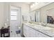 Clean bathroom with double vanity and granite countertop at 1732 Flamingo Ln, Sun City Center, FL 33573