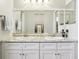 Modern bathroom with double vanity and large mirror at 1732 Flamingo Ln, Sun City Center, FL 33573