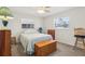 Well lit bedroom with a double bed and dresser at 1732 Flamingo Ln, Sun City Center, FL 33573