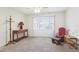 Spacious bedroom with neutral carpeting and bay window at 1732 Flamingo Ln, Sun City Center, FL 33573