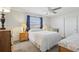 Bright bedroom with double bed, nightstands and ceiling fan at 1732 Flamingo Ln, Sun City Center, FL 33573