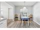 Bright dining room with table, chairs, and view to kitchen at 1732 Flamingo Ln, Sun City Center, FL 33573