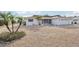 Single-story home with a gravel driveway and palm trees at 1732 Flamingo Ln, Sun City Center, FL 33573