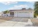 White single story home with a gravel yard at 1732 Flamingo Ln, Sun City Center, FL 33573