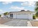 White single story home with a gravel yard at 1732 Flamingo Ln, Sun City Center, FL 33573