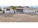 Front view of a single-story home with a gravel driveway at 1732 Flamingo Ln, Sun City Center, FL 33573