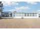 White house with a long, windowed back at 1732 Flamingo Ln, Sun City Center, FL 33573