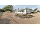 Back of a house with a pebble yard at 1732 Flamingo Ln, Sun City Center, FL 33573