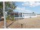 White house with large windows and screened enclosure at 1732 Flamingo Ln, Sun City Center, FL 33573