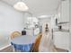 Modern kitchen with white cabinets, granite counters, and stainless steel appliances at 1732 Flamingo Ln, Sun City Center, FL 33573