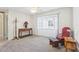 Cozy living room with neutral carpeting and bay window at 1732 Flamingo Ln, Sun City Center, FL 33573