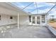 Covered patio with screened enclosure and backyard view at 1732 Flamingo Ln, Sun City Center, FL 33573