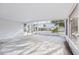 Covered patio with screened enclosure and backyard view at 1732 Flamingo Ln, Sun City Center, FL 33573