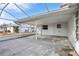 Covered patio with screened enclosure at 1732 Flamingo Ln, Sun City Center, FL 33573