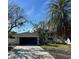 Updated single-story home with a modern facade and a spacious driveway at 1836 Jersey Ne St, St Petersburg, FL 33703