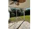 Covered patio with ceiling fan, overlooking backyard at 1836 Jersey Ne St, St Petersburg, FL 33703