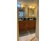 Double vanity bathroom with granite countertop at 18400 Gulf Blvd # 1505, Indian Shores, FL 33785