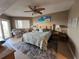 Spacious bedroom with king-size bed, ceiling fan, and ocean-themed decor at 18400 Gulf Blvd # 1505, Indian Shores, FL 33785
