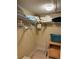 Large walk-in closet with shelving and rods at 18400 Gulf Blvd # 1505, Indian Shores, FL 33785