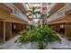 Lush courtyard with tropical plants and a central fountain at 18400 Gulf Blvd # 1505, Indian Shores, FL 33785