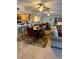 Bright dining area with table, chairs, and access to kitchen at 18400 Gulf Blvd # 1505, Indian Shores, FL 33785