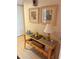 Well-lit entryway with console table and coastal-themed decor at 18400 Gulf Blvd # 1505, Indian Shores, FL 33785