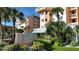 The Beach Cottage: inviting exterior, lush landscaping, and convenient parking at 18400 Gulf Blvd # 1505, Indian Shores, FL 33785