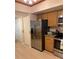 Stainless steel appliances and light wood cabinets in this kitchen at 18400 Gulf Blvd # 1505, Indian Shores, FL 33785