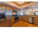 Modern kitchen with stainless steel appliances and light wood cabinets at 18400 Gulf Blvd # 1505, Indian Shores, FL 33785