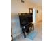Living area with large TV and access to balcony at 18400 Gulf Blvd # 1505, Indian Shores, FL 33785