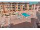 Expansive pool area with plenty of lounge chairs and a hot tub at 18400 Gulf Blvd # 1505, Indian Shores, FL 33785