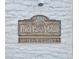 Charming building address sign with a decorative frame and clear street number at 200 1St Ave # 312, St Pete Beach, FL 33706