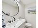 Bright bathroom with a large mirror, contemporary vanity, and modern fixtures at 200 1St Ave # 312, St Pete Beach, FL 33706