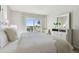 Cozy bedroom with sliding glass doors leading to a balcony and beautiful views at 200 1St Ave # 312, St Pete Beach, FL 33706