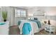 Cozy bedroom featuring blue accents and ample natural light at 200 1St Ave # 312, St Pete Beach, FL 33706