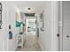 Inviting condo entryway featuring neutral decor, art, and a glimpse of the bright living area at 200 1St Ave # 312, St Pete Beach, FL 33706