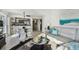 Stylish living room with dining area, kitchen, and ocean views at 200 1St Ave # 312, St Pete Beach, FL 33706