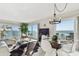 Bright living area features tile floors, stylish decor, dining area and stunning ocean view at 200 1St Ave # 312, St Pete Beach, FL 33706