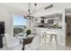 Open concept living with dining and kitchen areas with ocean views at 200 1St Ave # 312, St Pete Beach, FL 33706