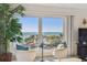 Charming seating area with stunning ocean views from large windows at 200 1St Ave # 312, St Pete Beach, FL 33706