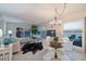 Inviting living room boasting panoramic ocean views, modern decor, and stylish dining area at 200 1St Ave # 312, St Pete Beach, FL 33706
