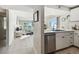 Open floorplan seamlessly connects the kitchen and living area with stunning ocean views at 200 1St Ave # 312, St Pete Beach, FL 33706