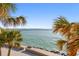 Enjoy breathtaking ocean views framed by lush palm trees in this idyllic coastal setting at 200 1St Ave # 312, St Pete Beach, FL 33706
