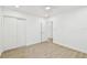 Bright bedroom with wood-look floors and double doors leading to closet at 201 S Shore Crest Dr, Tampa, FL 33609