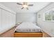 Bright bedroom with wood floors, built-in closet, and ceiling fan at 210 5Th S Ave # 307, St Petersburg, FL 33701