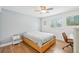 Spacious bedroom with light wood flooring and ceiling fan at 210 5Th S Ave # 307, St Petersburg, FL 33701