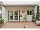 Modern building entrance with brick pavers and potted plants at 210 5Th S Ave # 307, St Petersburg, FL 33701