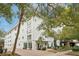 White three-story building with lush landscaping and parking at 210 5Th S Ave # 307, St Petersburg, FL 33701