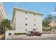 Building exterior showcasing modern design and ample parking at 210 5Th S Ave # 307, St Petersburg, FL 33701