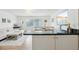 Open concept kitchen with granite countertops and breakfast bar at 210 5Th S Ave # 307, St Petersburg, FL 33701